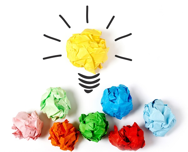 Paper ball forming a lightbulb, white background